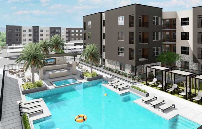 A pool surrounded by lounge chairs and umbrellas is the centerpiece of a resort-style courtyard at Refinery at Pointe17 Apartments, Phoenix, AZ, 85085