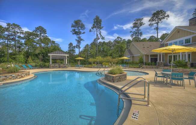 Resort-style swimming pool with sundeck and poolside kitchen at Lullwater at Blair Stone
