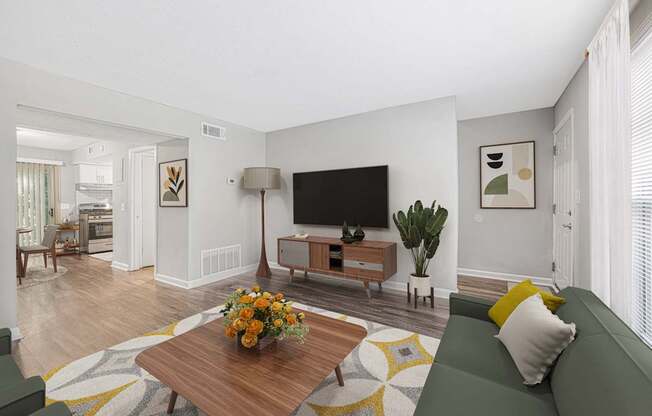 a living room with a couch and a coffee table and a television