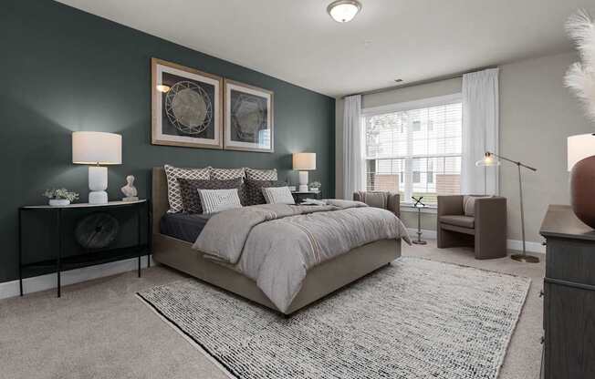 A bedroom with a large bed and a window with curtains.