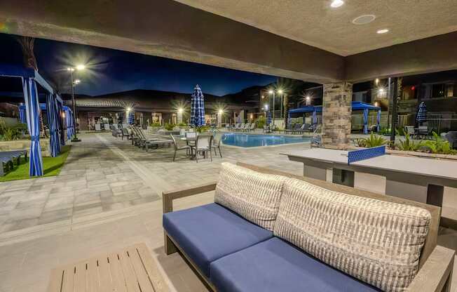 Patio furniture under the build in pool side ramada