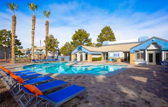 the pool at our apartments is full of lounge chairs and a resort style pool