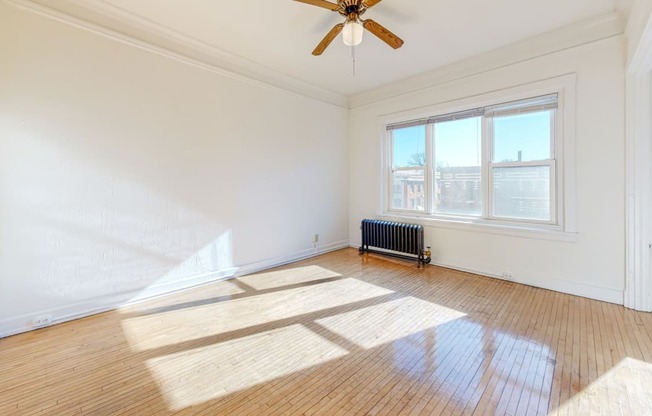 Apartment Layout with Restored Hardwood Floors, a Ceiling Fan, and Views Overlooking the City at The Park Apartments in Minneapolis, MN