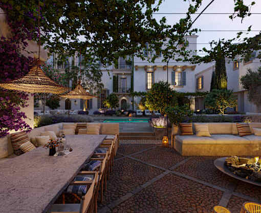 a patio with a table and chairs and a pool