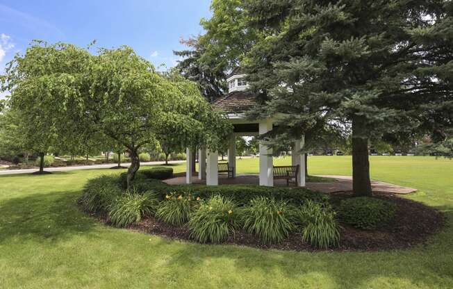 a park with trees and a gazebo at Village Club of Rochester Hills, Shelby Township, 48317