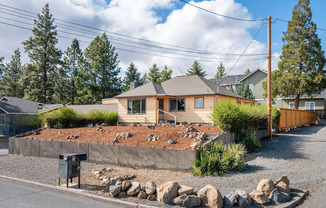 Beautiful two-story house on .28 acres with two bonus rooms, fully fenced backyard, and a triple-bay detached garage.