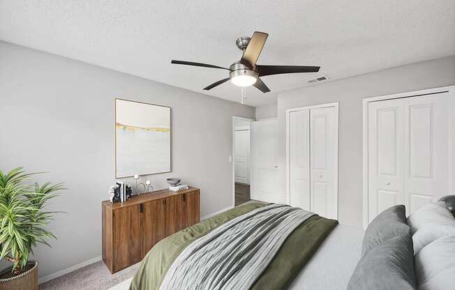 Model Bedroom with Carpet and Double Closets at Vue at Baymeadows Apartments in Jacksonville, FL.