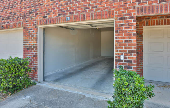 an empty garage in a brick building