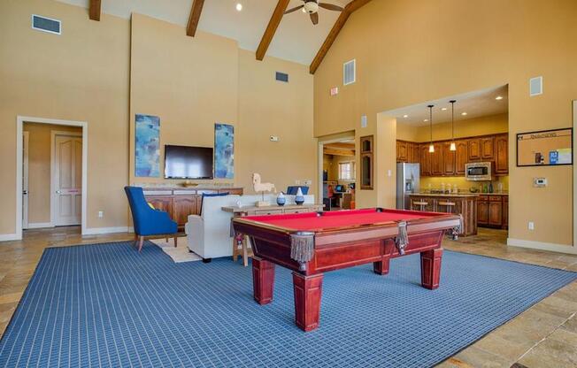 game room with a pool table and other games to play