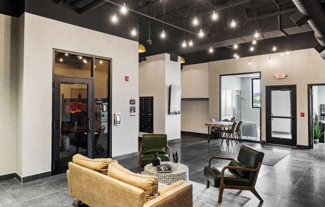 a living room with a couch and chairs and a dining room at EagleRidge Plaza Residences, Fargo