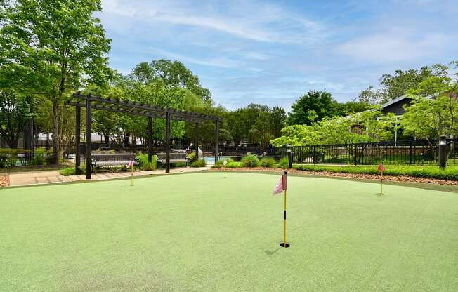 a putting green at the whispering winds apartments in pearland, tx  at Riverset Apartments, Memphis