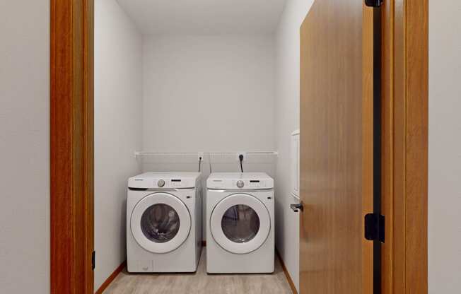 a washer and dryer in a laundry room with a door