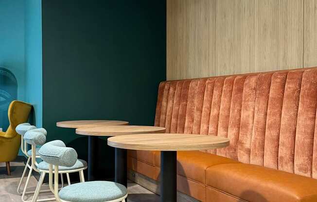 a seating area with a table and chairs and a couch