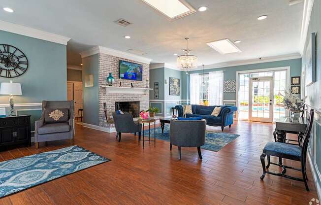 A living room with a fireplace and a television.