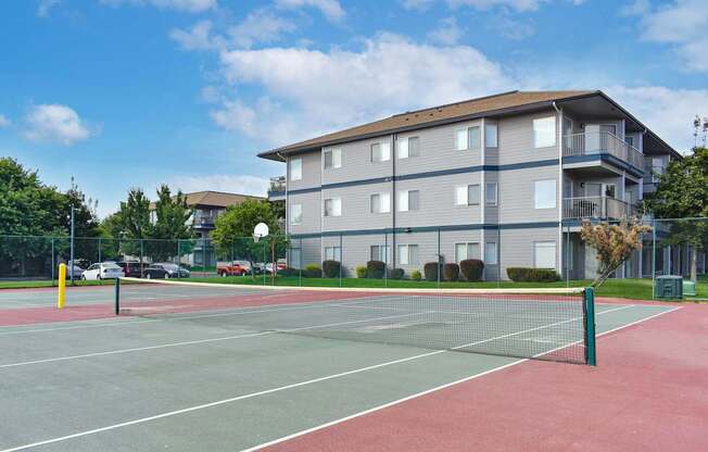 a tennis court with a building in the background  at Shoreline Village, Richland, WA