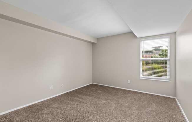 Bedroom with gray walls and carpet at Creve Coeur, Creve Coeur, MO