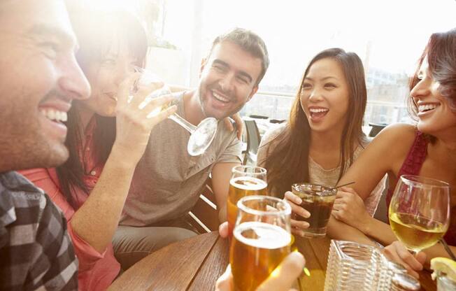 a group of people drinking beer