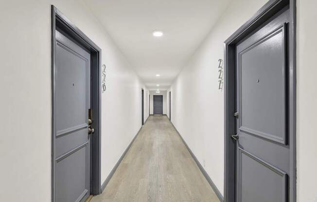A long hallway with doors on both sides.