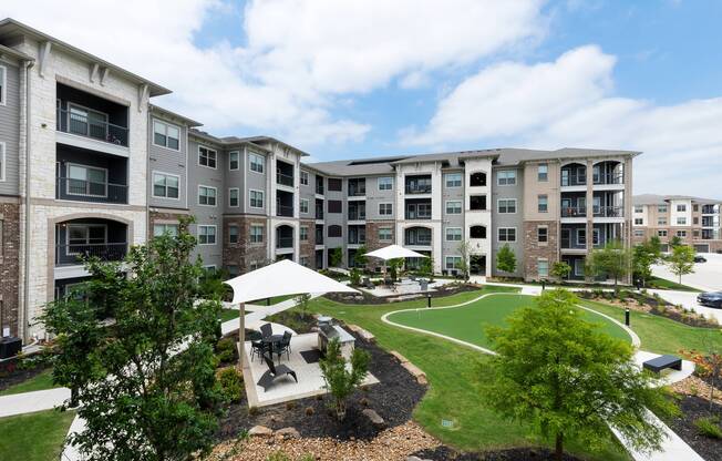 Exterior view of residential buildings at Cyan Craig Ranch apartments for rent in McKinney, TX
