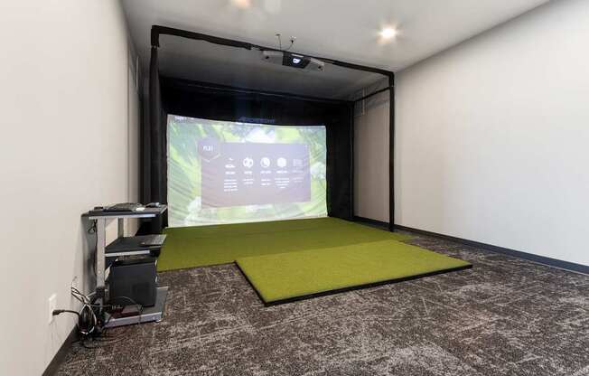 A projection room with a screen and a projector.