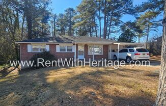 Great Brick Ranch / Harwood Floors / Huge Shop or Extra Storage / No Garage / Great Private Back Yard/ Great Location