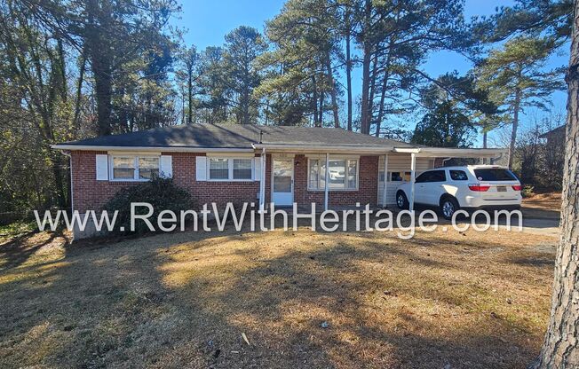 Great Brick Ranch / Harwood Floors / Huge Shop or Extra Storage / No Garage / Great Private Back Yard/ Great Location