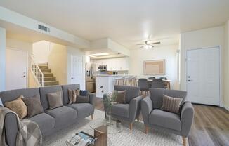 a living room filled with furniture and a fireplace