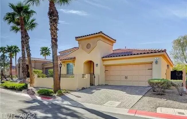 Exquisite fully furnished 2 Bed/2 Bath, Den/Office Single Story home in prestigious Lake Las Vegas. Strip and Golf Course Views