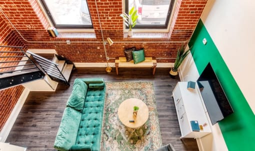 an overhead view of a living room with a couch and a table