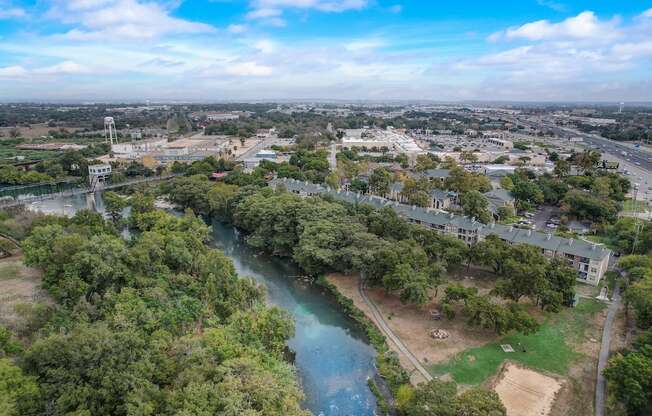 an aerial view of the river and the city