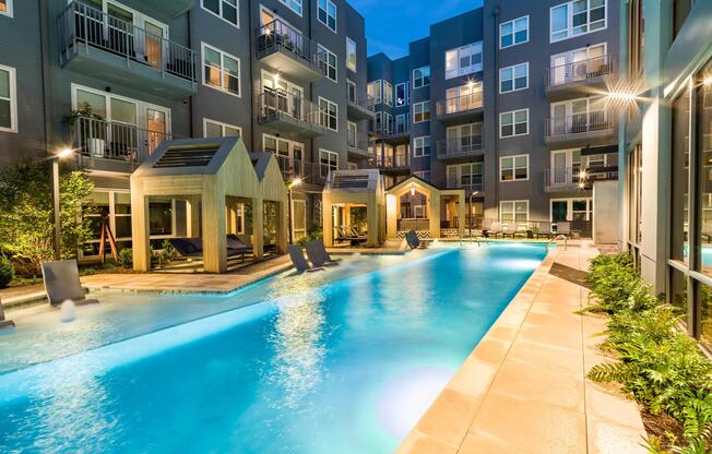Evenings glow poolside at Modera Old Ivy, where cabanas, resort-style waters, and a polished courtyard set the tone for Atlanta living.