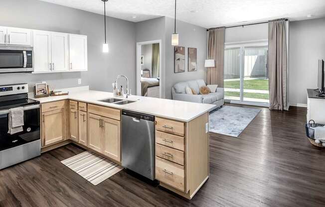 A modern kitchen with wooden cabinets and a large island.