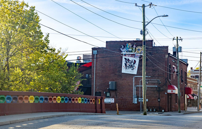 a red brick building with a sign on the side of it