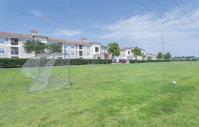 a soccer field at the whispering winds apartments in pearland, tx