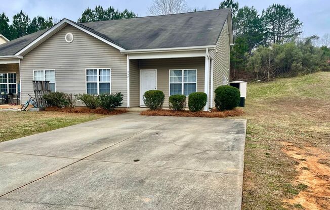 This two-story, 4-bedroom, 2-bath duplex in Fort Mill, SC sits on a corner lot