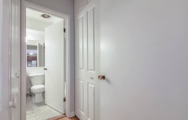 a bedroom with a bed and a mirror