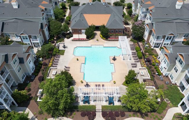 Fenwyck Manor's lushly landscaped pool and sundeck area