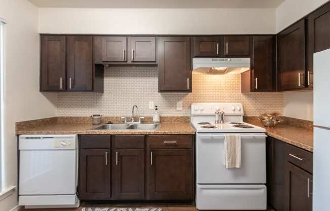 This is a photo of the kitchen of the 590 square foot 1 bedroom, 1 bath model apartment at The Biltmore Apartments located int he Vickery Meadow neighborhood of Dallas, TX.