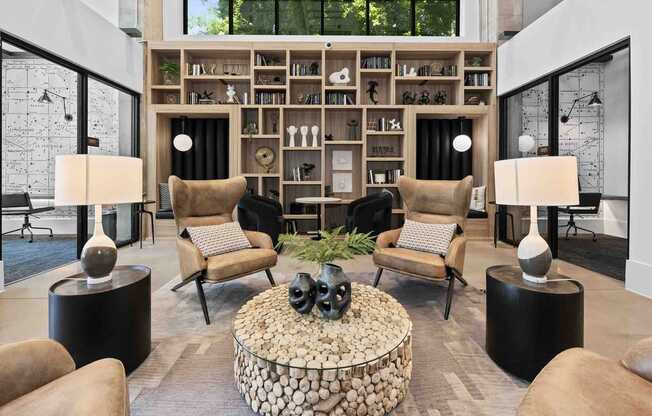 A living room with a stone coffee table and a bookshelf filled with books.