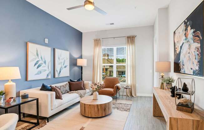 A Living Room With a White Couch at The Aster Apartments, Cary, 27519