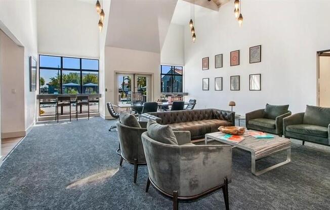 a living room filled with furniture and a large window