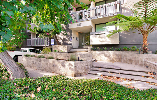 the stairs up to the entrance of an apartment building