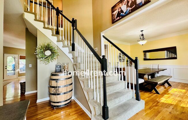 Beautiful Four Bedroom Home in a Quiet Neighborhood w/ an Updated Kitchen, Wood Floors, and a Finished Basement!