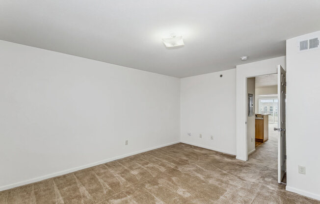 Spacious Bedroom with Plush Carpeting at Stoney Pointe Apartment Homes in Wichita, KS