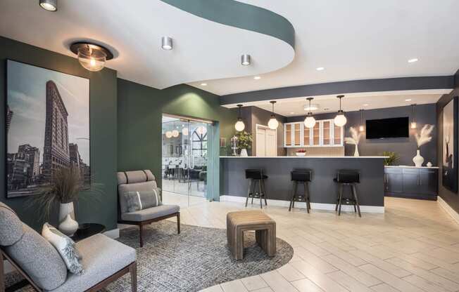 a lobby with tables and chairs and a bar at 15 Bank Apartments, White Plains, NY
