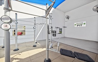 a workout room with weights and ropes in a gym