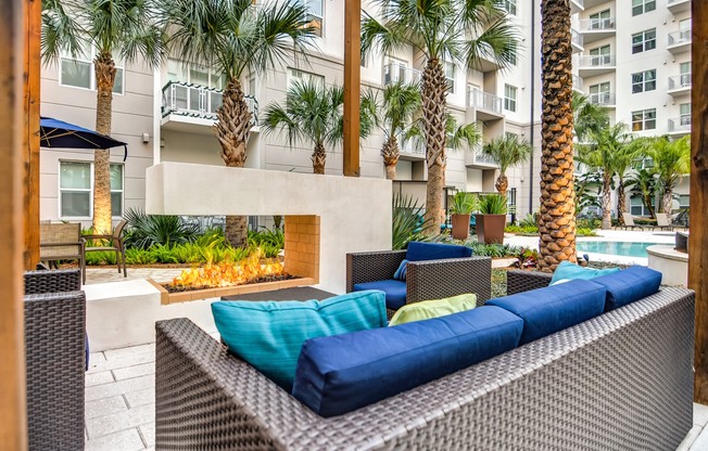 Juno at Winter Park apartments in Winter Park Florida photo of pool deck seating with fire feature