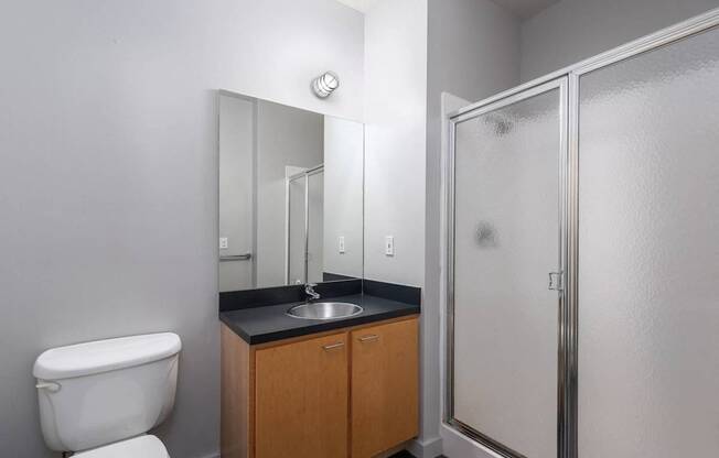 an empty bathroom with a toilet sink and shower