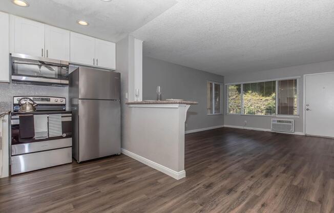 a large kitchen with stainless steel appliances