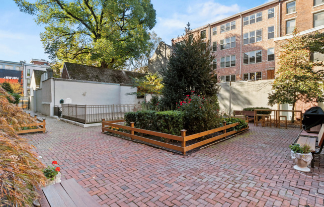 Experience tranquility in this enchanting brick courtyard, perfect for outdoor relaxation and gatherings.